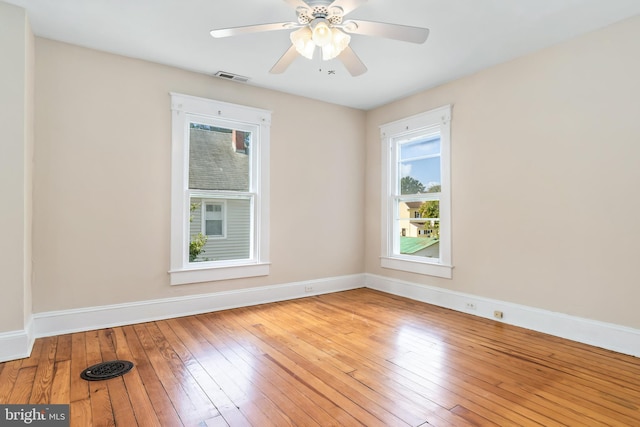 unfurnished room with ceiling fan and light hardwood / wood-style flooring