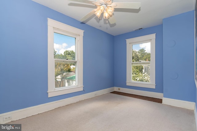 spare room featuring carpet flooring and ceiling fan