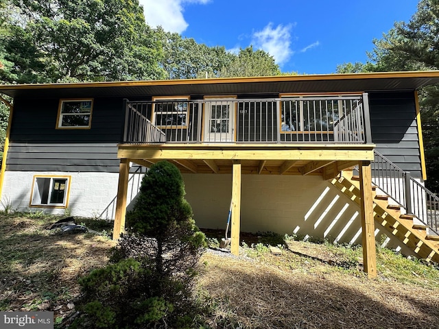 rear view of property with a deck