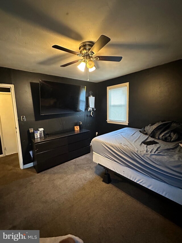 bedroom featuring ceiling fan and carpet floors