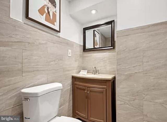 bathroom featuring toilet and vanity