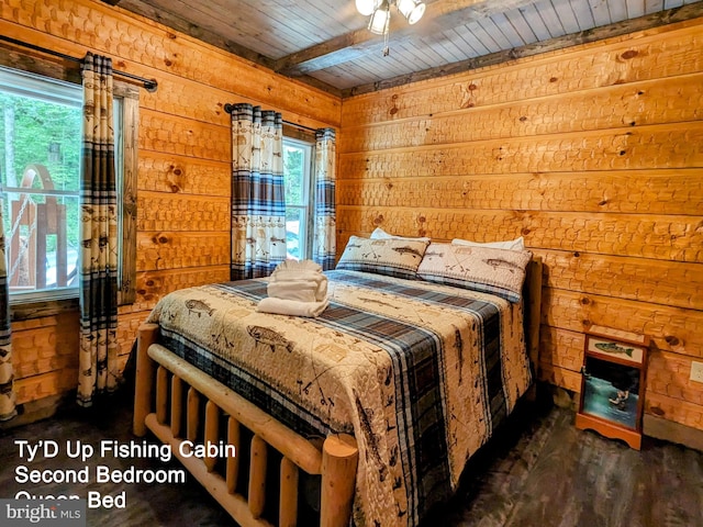 bedroom featuring wooden walls, multiple windows, dark hardwood / wood-style floors, and wood ceiling