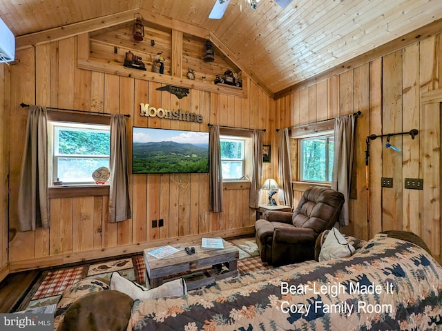 living room featuring wood walls, ceiling fan, wooden ceiling, and vaulted ceiling