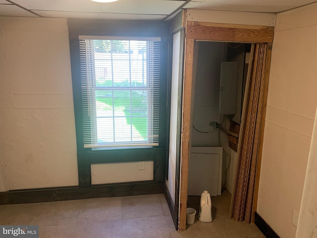 interior space with washer / dryer, electric panel, and a wealth of natural light