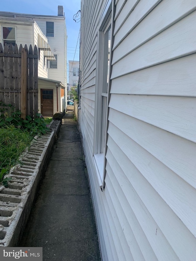 view of home's exterior with fence