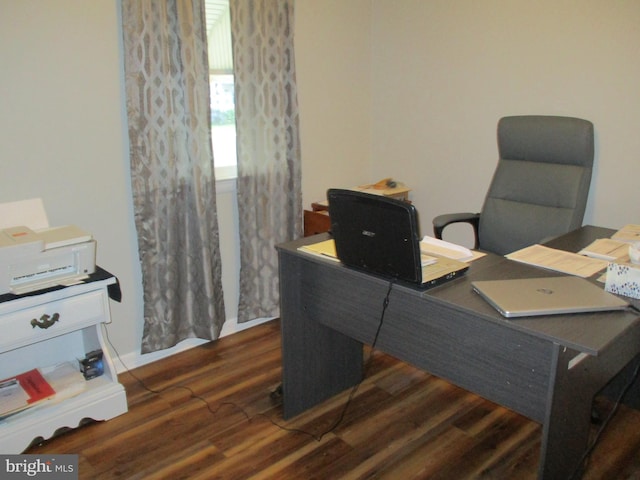 office space with dark hardwood / wood-style flooring