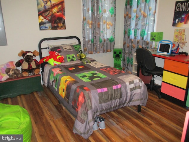 bedroom featuring dark wood-type flooring