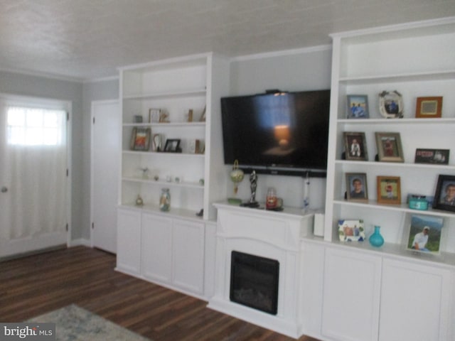 unfurnished living room featuring a textured ceiling, ornamental molding, and dark hardwood / wood-style floors