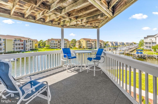 balcony featuring a water view