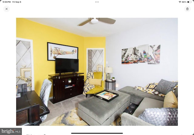 living room with ceiling fan and light carpet