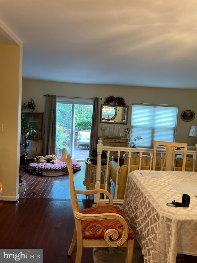 dining room with dark wood-type flooring