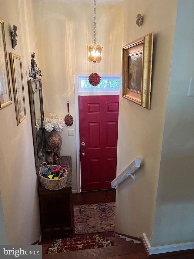 doorway featuring an inviting chandelier