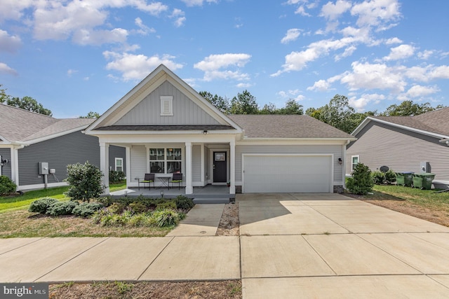 view of front of house with a garage and a porch