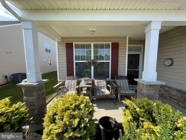 exterior space featuring a porch and central AC