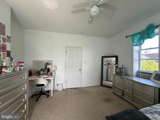 bedroom featuring light carpet, cooling unit, and ceiling fan