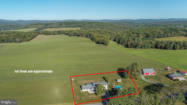 birds eye view of property with a rural view