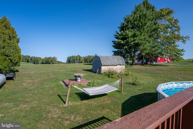 view of yard featuring a storage unit and a rural view