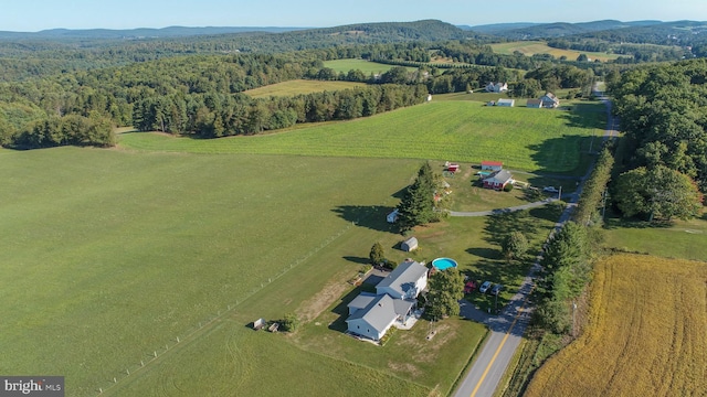 birds eye view of property with a rural view