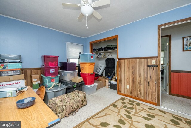 living room with ceiling fan and hardwood / wood-style floors