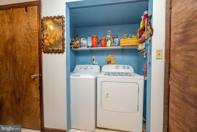 clothes washing area featuring washing machine and clothes dryer