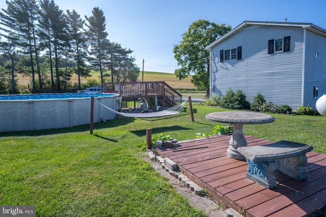 view of yard featuring a swimming pool side deck