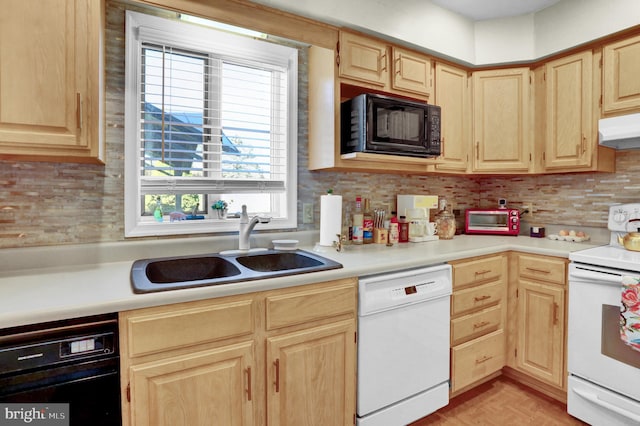 kitchen featuring black appliances and light brown cabinetry