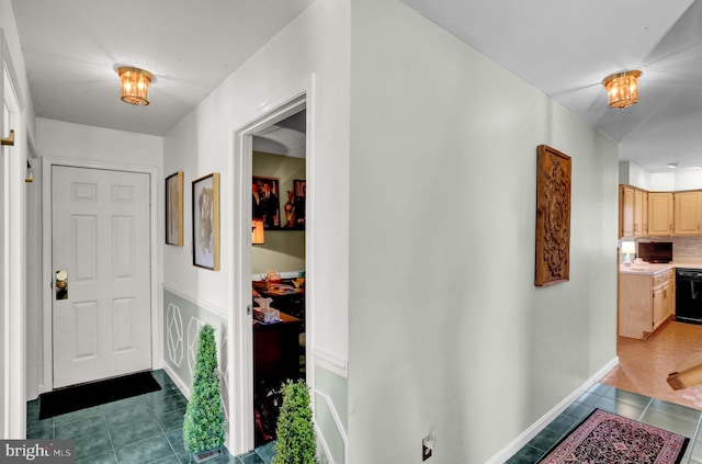 corridor with dark tile patterned floors