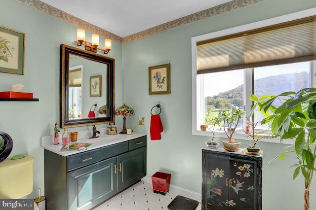 bathroom with a mountain view and vanity