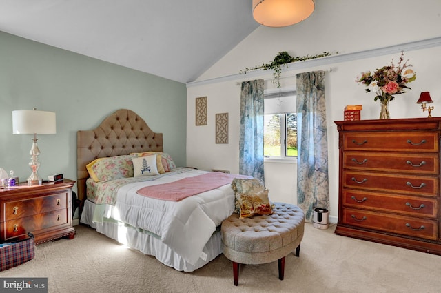 carpeted bedroom with vaulted ceiling