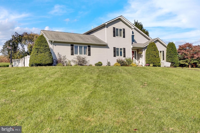 view of property featuring a front yard