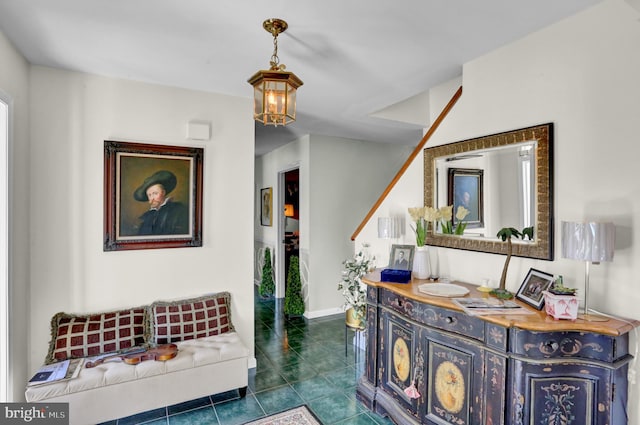 interior space featuring vanity, a chandelier, and tile patterned flooring