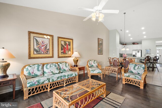 living area with baseboards, ceiling fan, wood finished floors, high vaulted ceiling, and recessed lighting