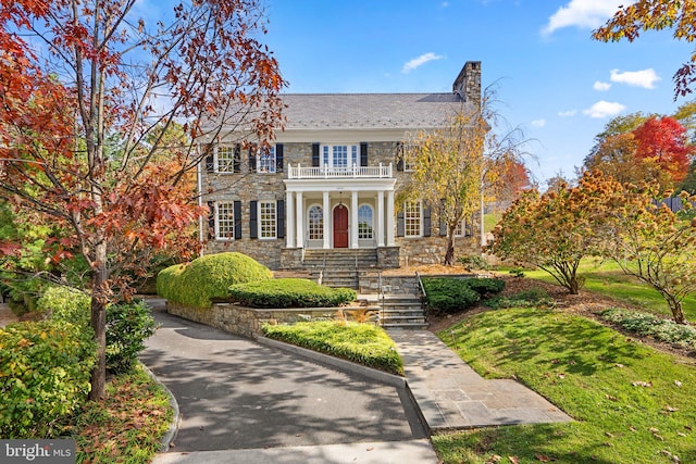 colonial home with a balcony