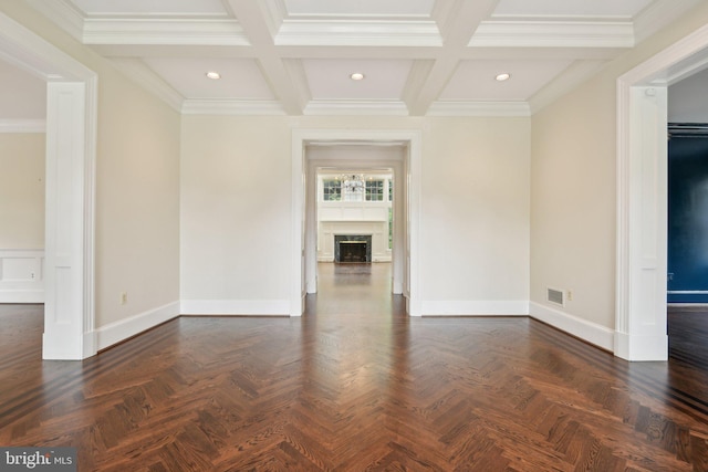 unfurnished room with coffered ceiling, ornamental molding, and dark parquet floors