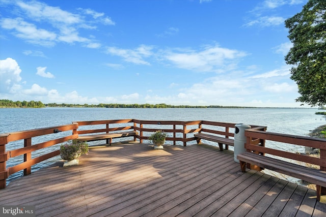 view of dock with a deck with water view