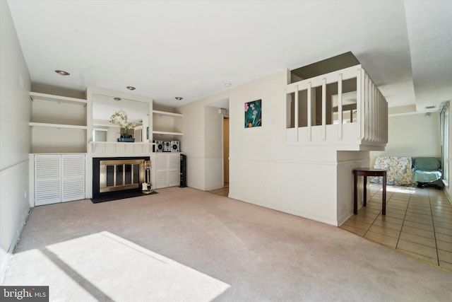 unfurnished living room featuring tile patterned flooring