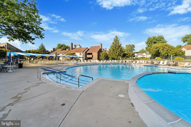 view of pool featuring a patio