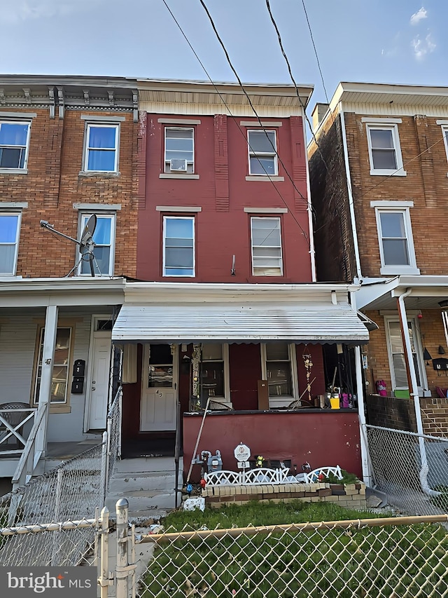 multi unit property with a gate and a fenced front yard