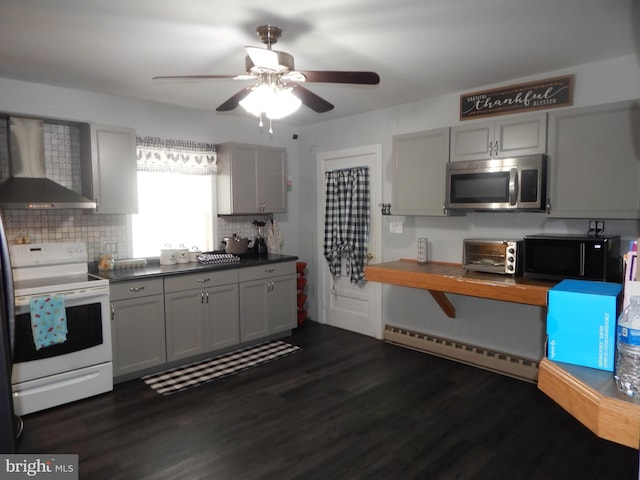 kitchen featuring gray cabinets, electric stove, wall chimney exhaust hood, baseboard heating, and ceiling fan