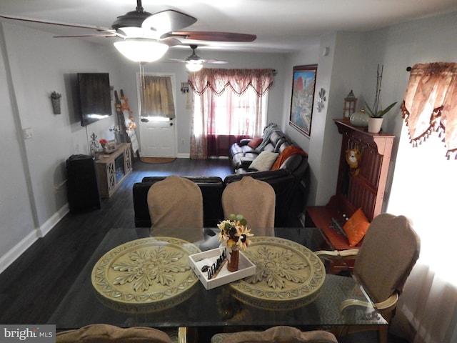 dining room with wood finished floors and baseboards