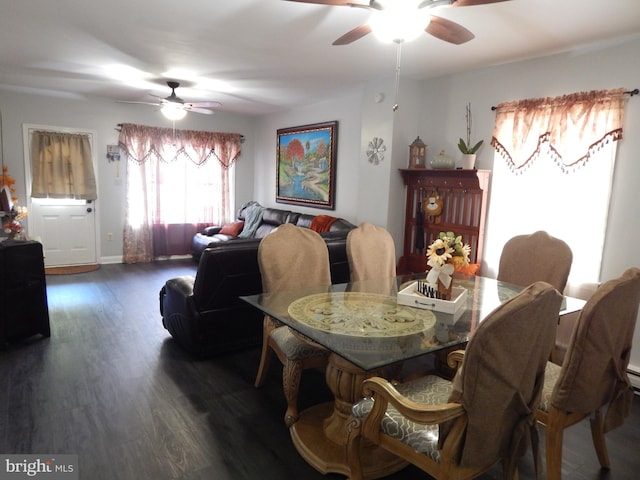 dining room with baseboards, a ceiling fan, and wood finished floors