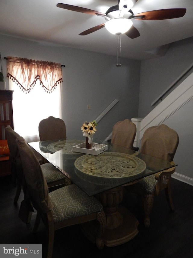 dining space featuring a ceiling fan