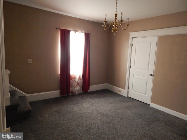 carpeted empty room with baseboards, a chandelier, and stairs