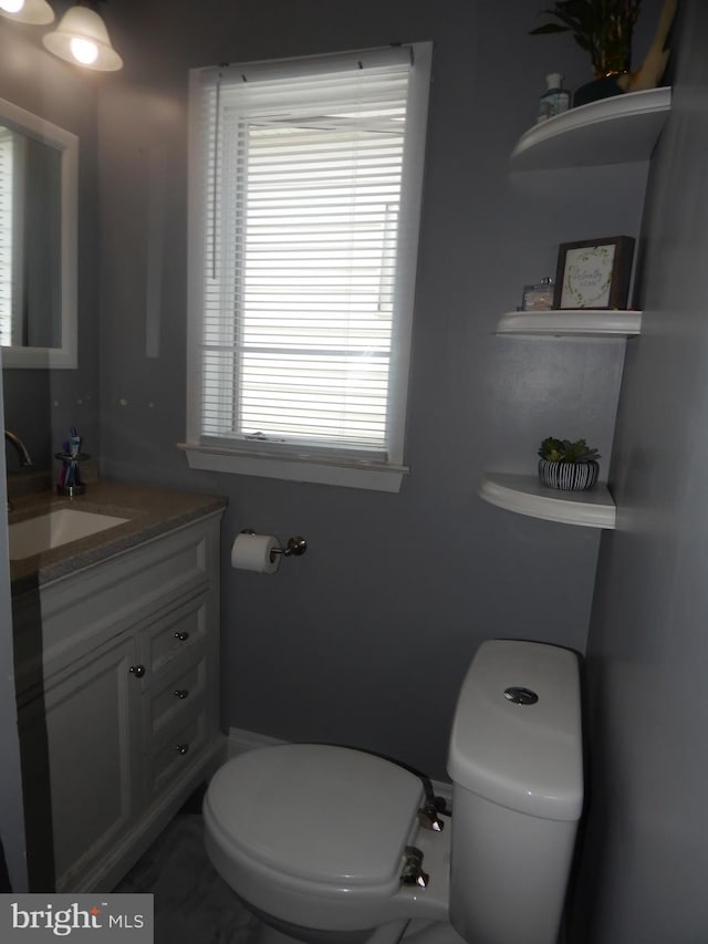 bathroom with vanity and toilet