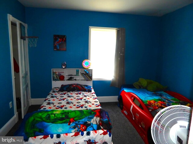 carpeted bedroom with baseboards