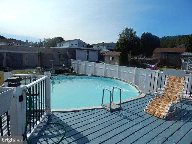 view of pool featuring a wooden deck