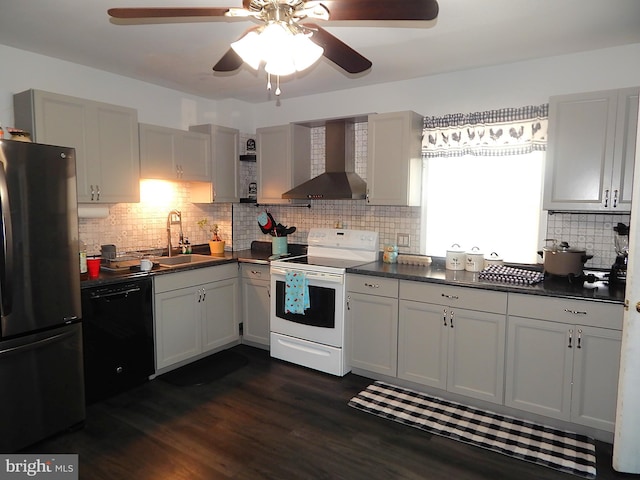 kitchen featuring white electric range, a sink, black dishwasher, freestanding refrigerator, and wall chimney exhaust hood