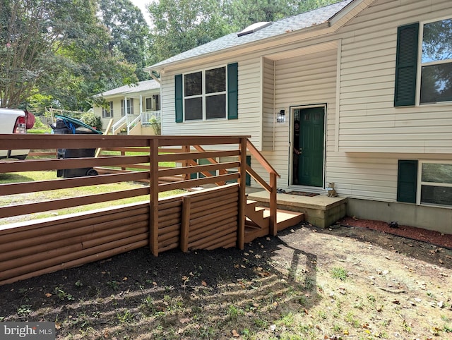 back of house featuring a deck