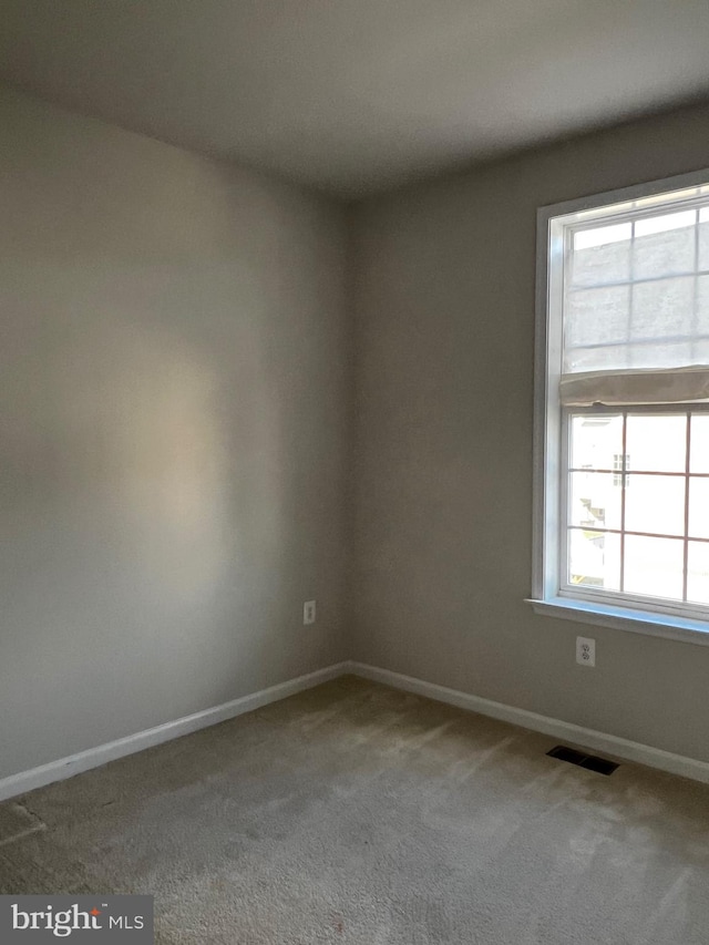 unfurnished room with carpet floors