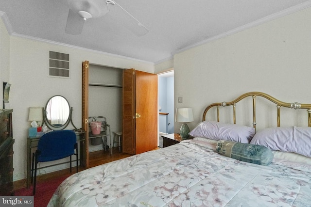 bedroom featuring ceiling fan, a closet, and crown molding